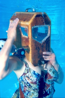 Image 2 - Bauer, diving underwater in a wooden Griswood helmet.